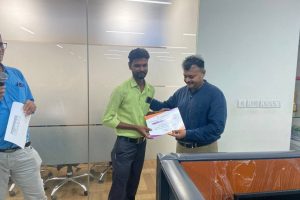 Suresh BM of Udumalpet receiving the award for second place with Rs.42 lacs of business achievement