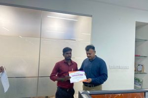 Gandhi BM of Acharapakkam receiving the award for 3rd place with Rs.41 lacs of business achievement